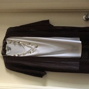 Brown knit shrug with white tank & necklace